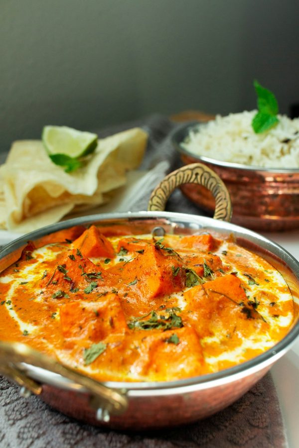 Paneer butter masala in a karahi with basmati rice — vegetarian Indian food in Leduc, Alberta